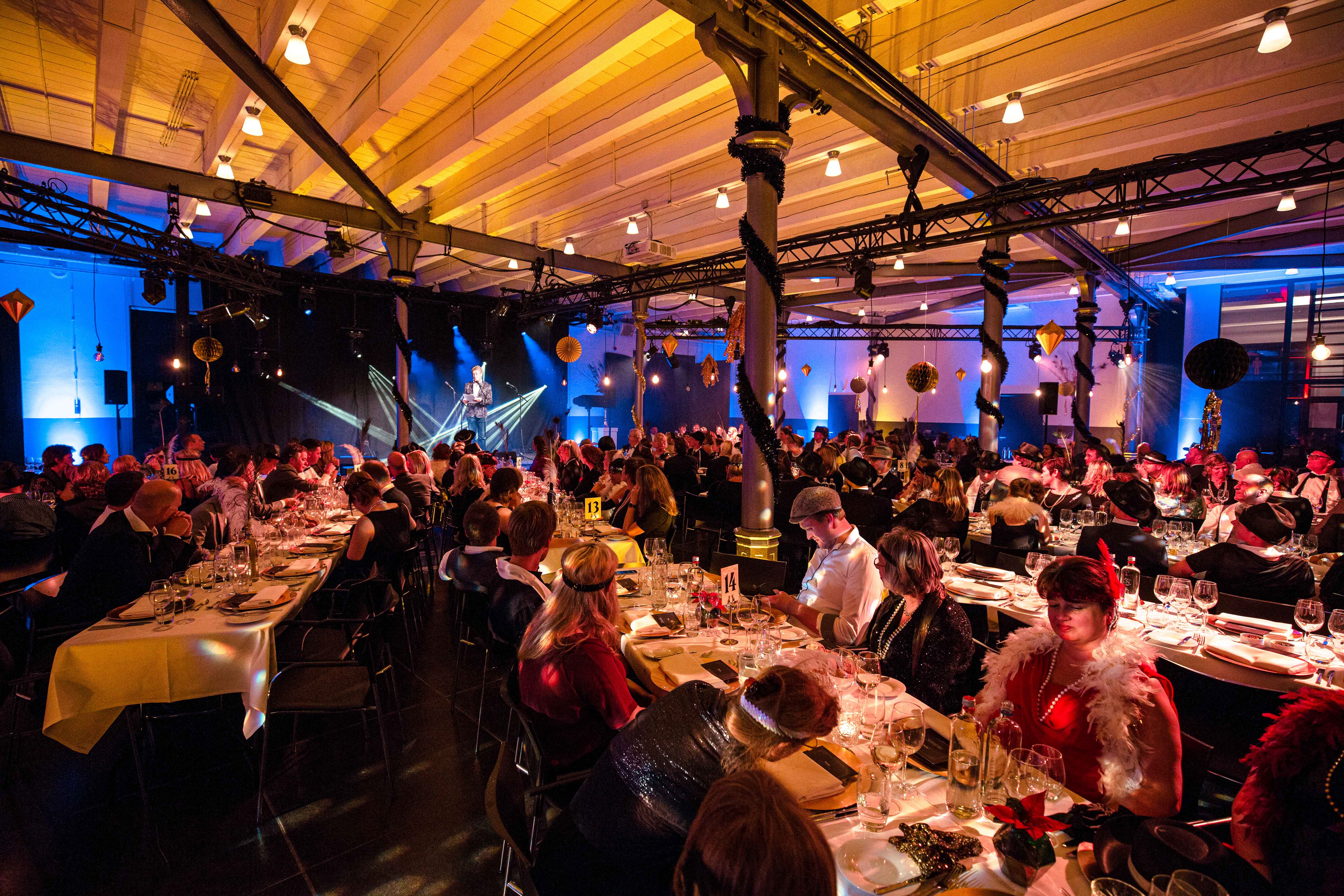 The Event Area - dinner large setting 2 Elegant dinner event at Taets Art and Event Park near Amsterdam and Zaandam, with beautifully set tables and ambient lighting.