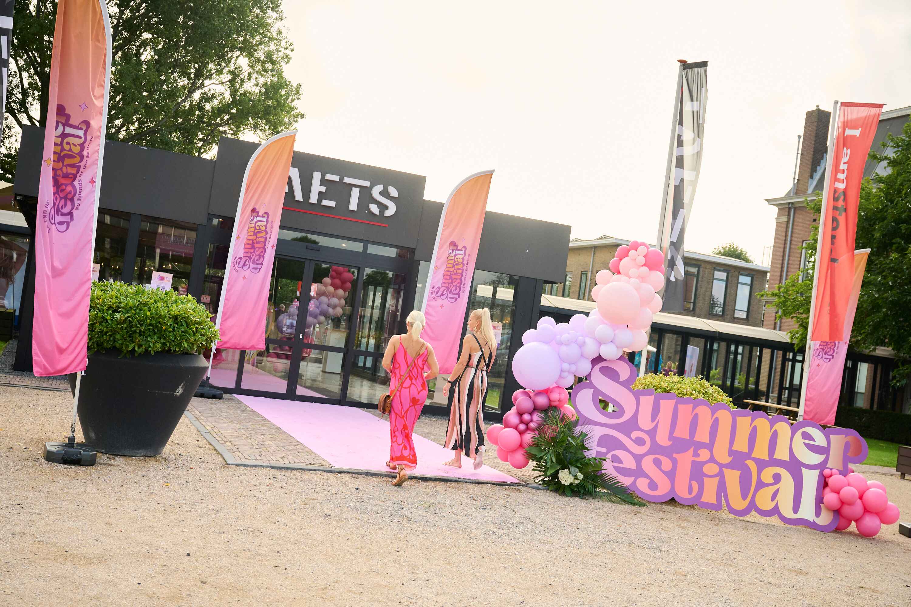 "Festival at Taets Art and Event Park near Amsterdam and Zaandam, with outdoor stages, live performances, and vibrant crowds."