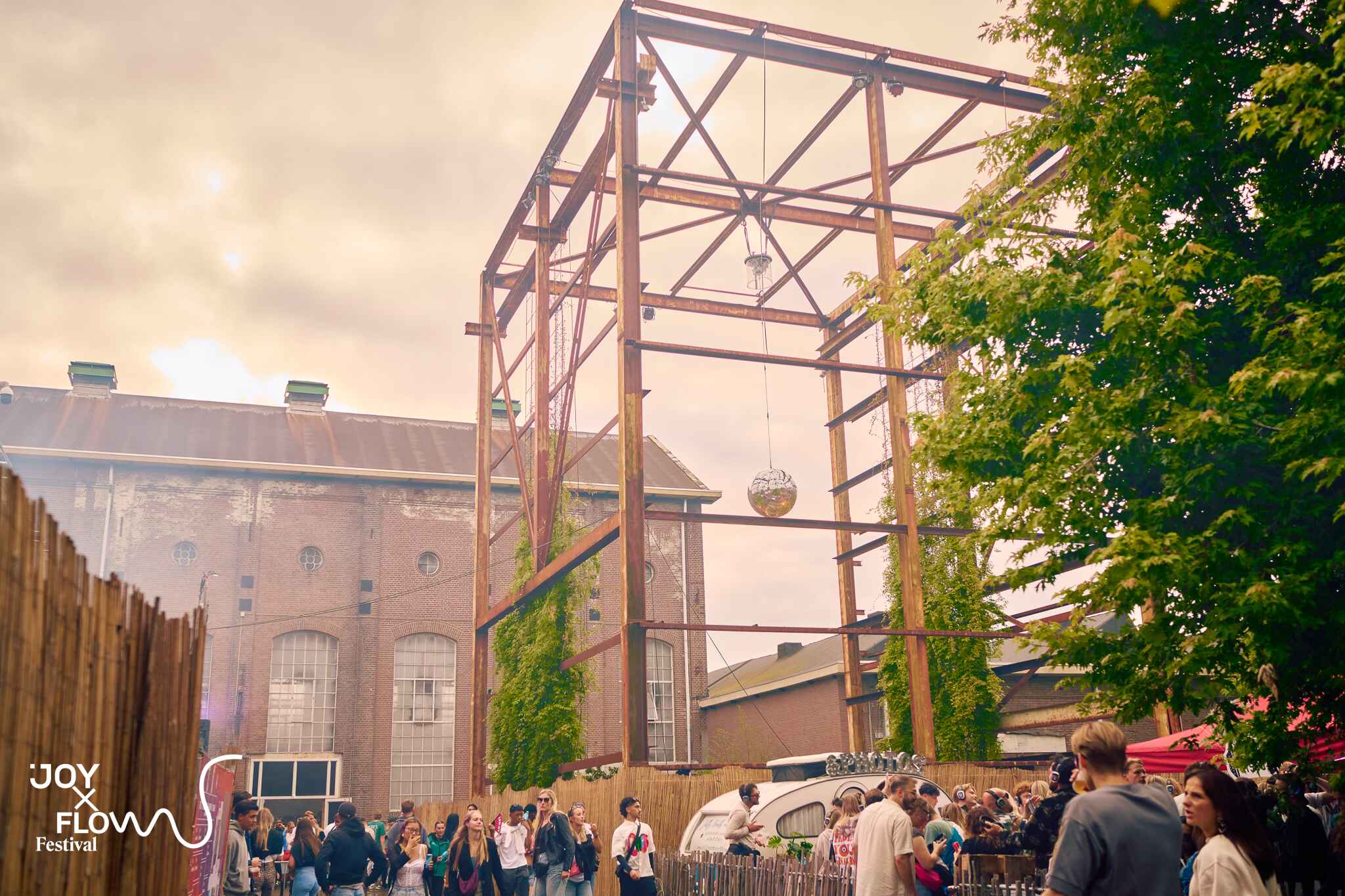 "Festival at Taets Art and Event Park near Amsterdam and Zaandam, with outdoor stages, live performances, and vibrant crowds."