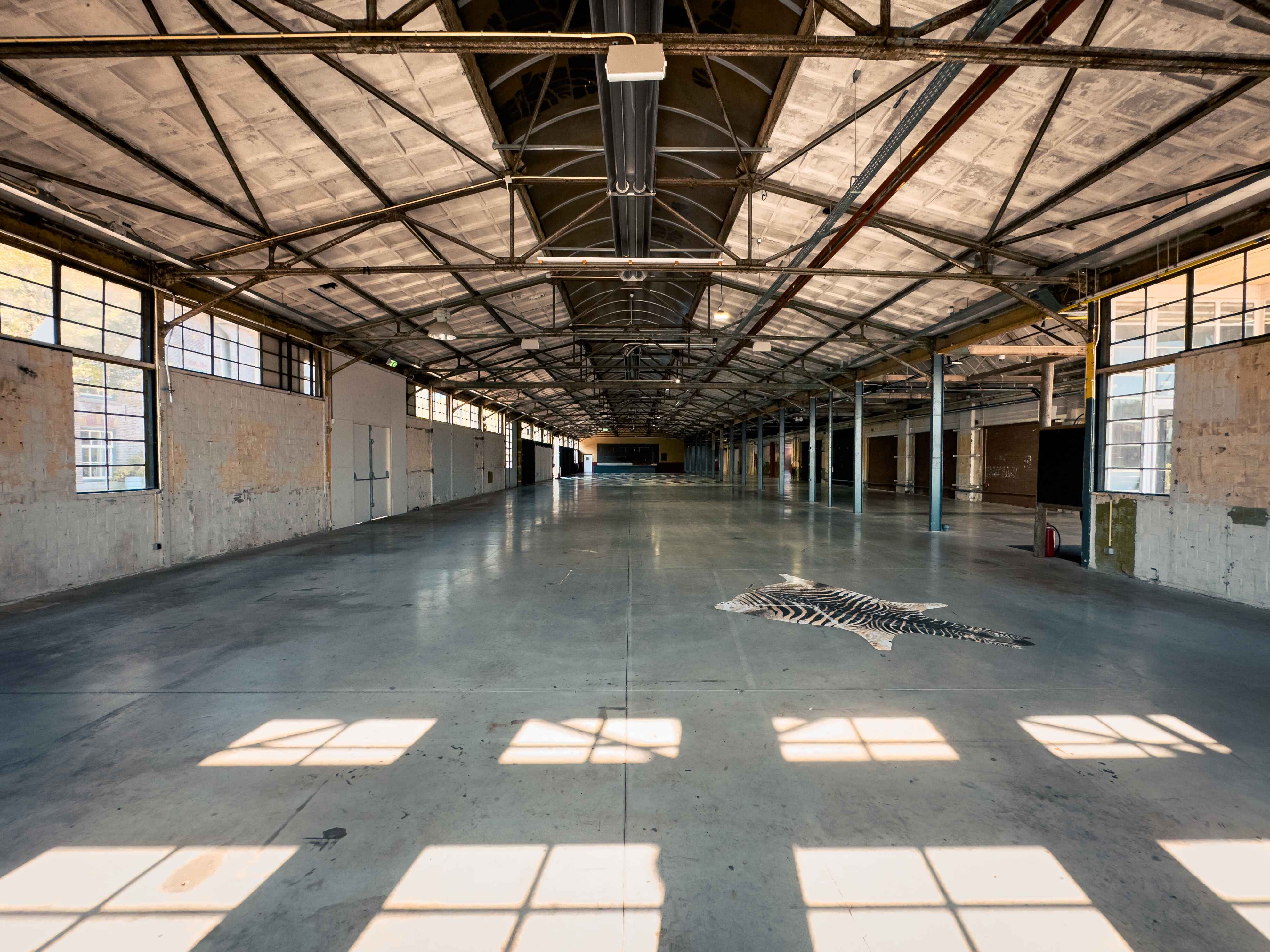 "Yada Yada event space at Taets Art and Event Park in Amsterdam and Zaandam, an industrial venue perfect for weddings, conferences, dinners, dance events, and more, set in a historic munitions factory."