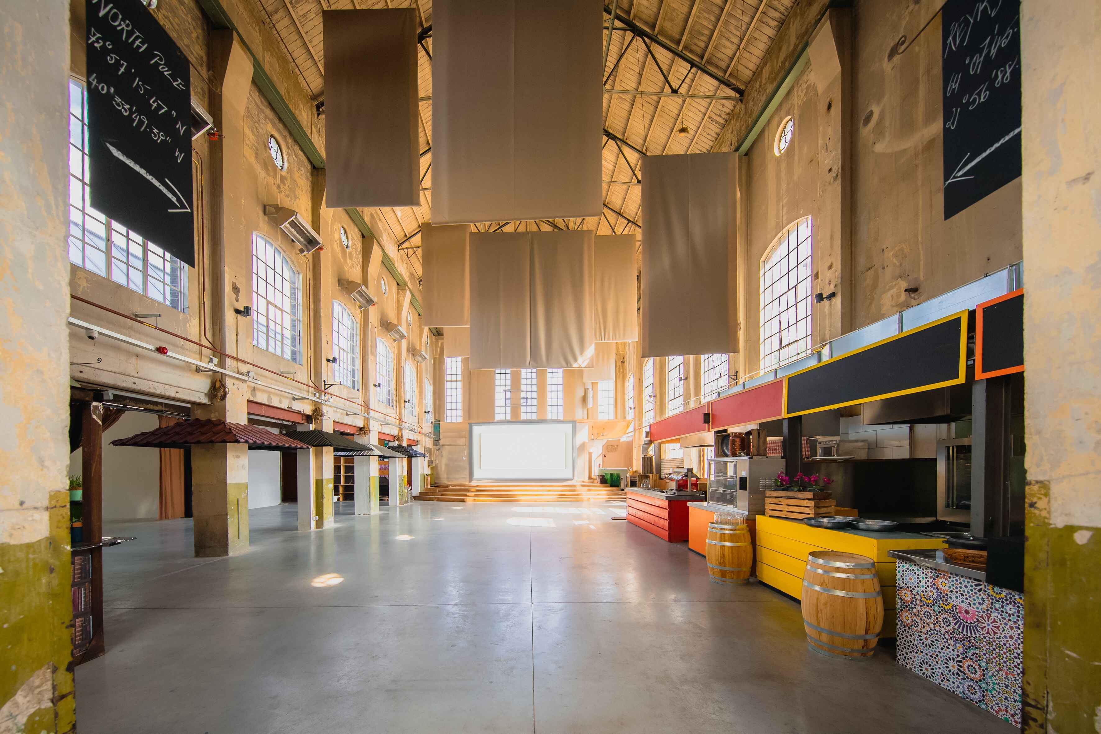 The Cathedral - empty + large screen setting "Yada Yada event space at Taets Art and Event Park in Amsterdam and Zaandam, an industrial venue perfect for weddings, conferences, dinners, dance events, and more, set in a historic munitions factory."