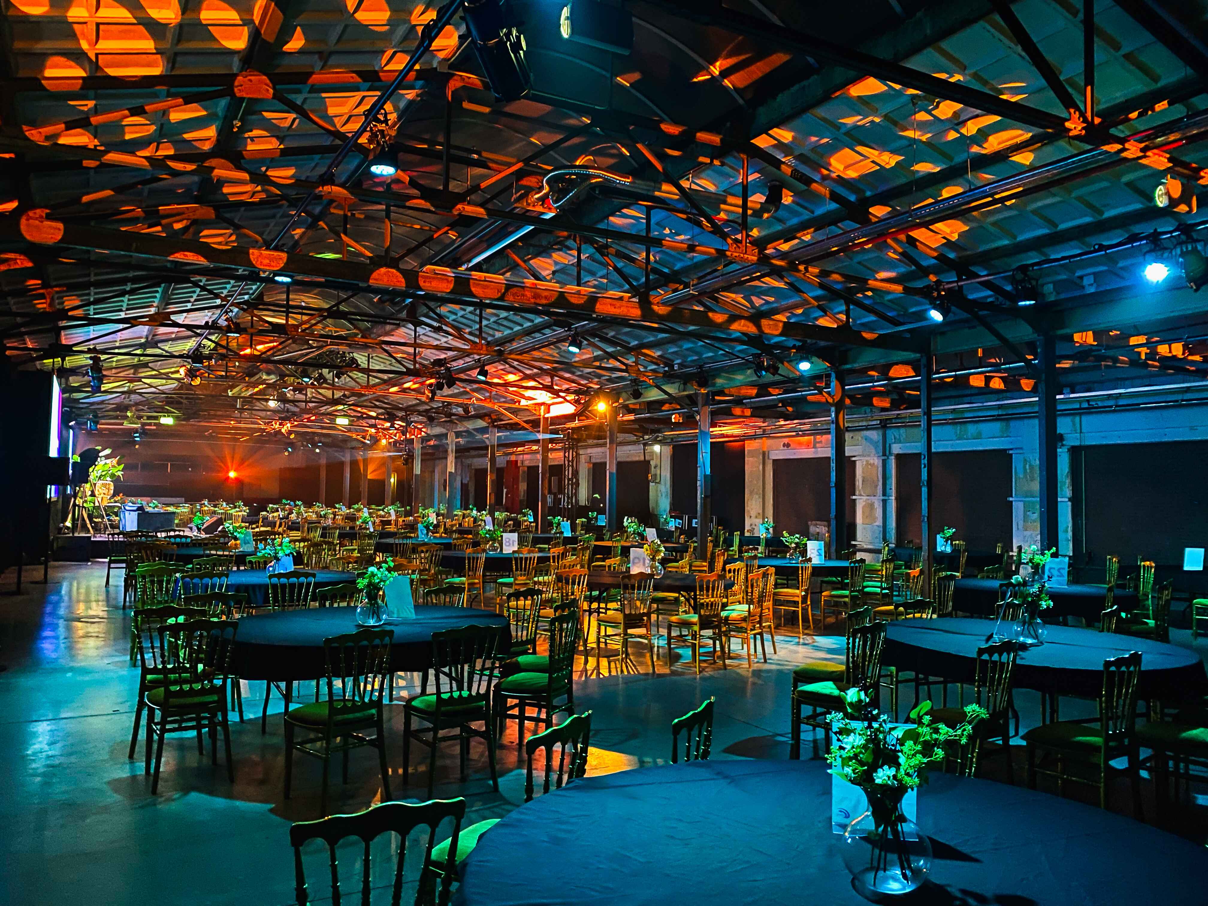 The Marketplace - dinner setting "Yada Yada event space at Taets Art and Event Park in Amsterdam and Zaandam, an industrial venue perfect for weddings, conferences, dinners, dance events, and more, set in a historic munitions factory."