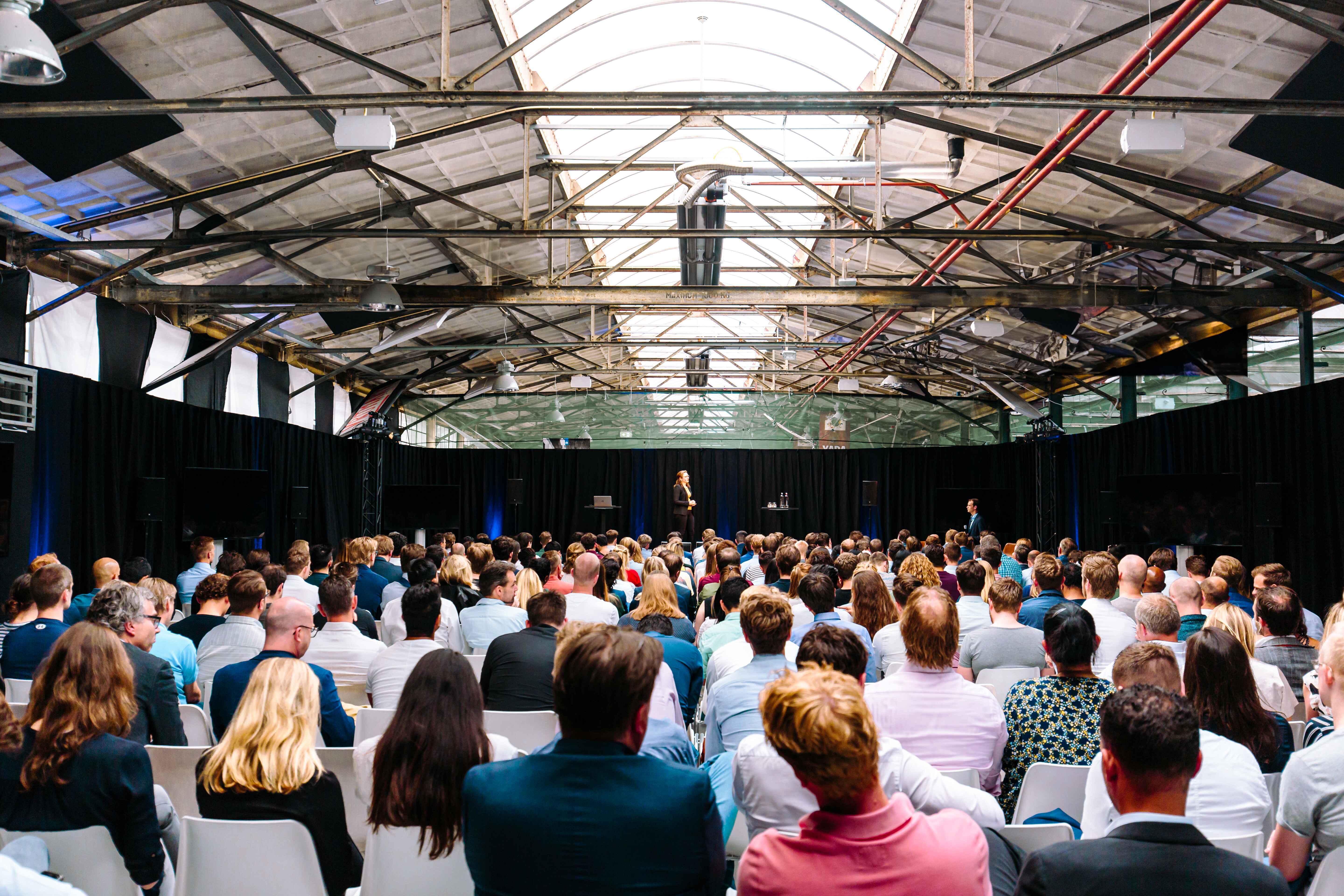 The Marketplace - plenary box setting "Yada Yada event space at Taets Art and Event Park in Amsterdam and Zaandam, an industrial venue perfect for weddings, conferences, dinners, dance events, and more, set in a historic munitions factory."